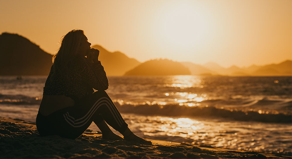 depressed woman at beach